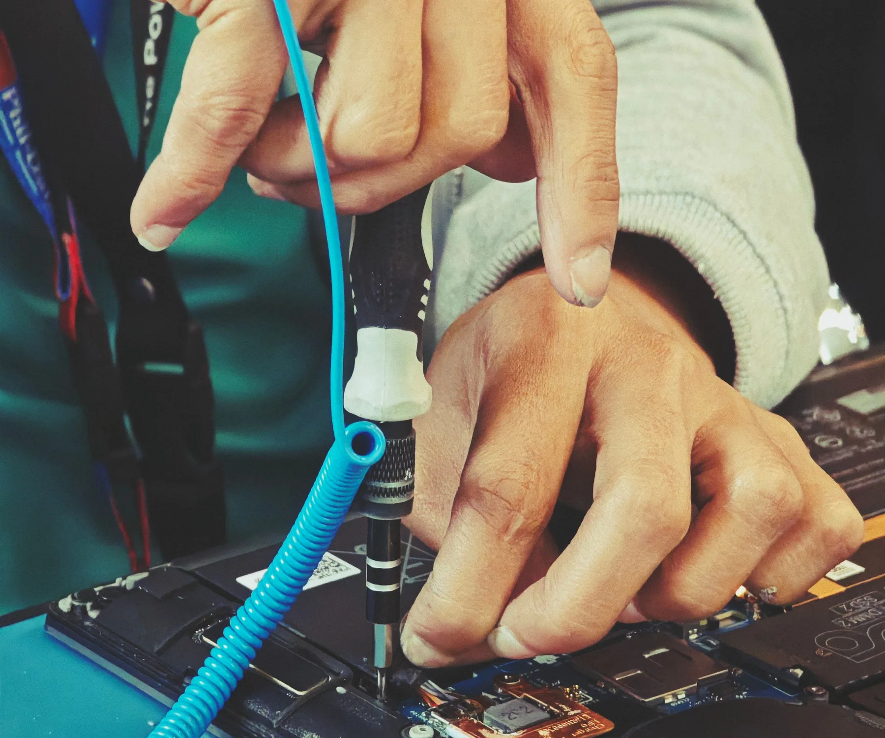 Close-up of a technician repairing the internal components of a laptop